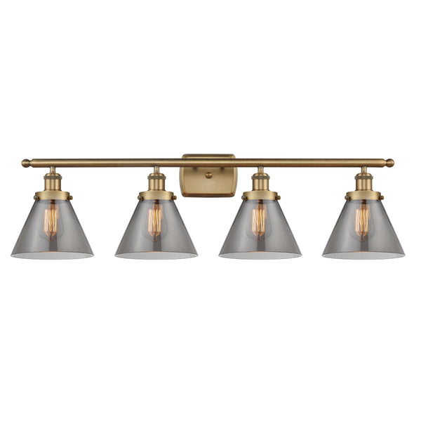 Cone Bath Vanity Light shown in the Brushed Brass finish with a Plated Smoke shade