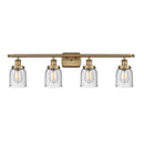 Bell Bath Vanity Light shown in the Brushed Brass finish with a Seedy shade