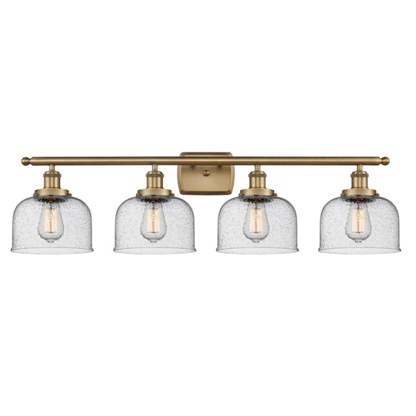 Bell Bath Vanity Light shown in the Brushed Brass finish with a Seedy shade