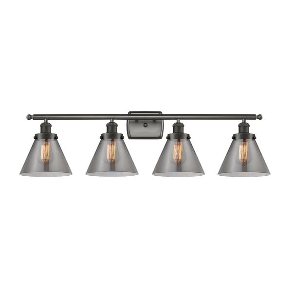 Cone Bath Vanity Light shown in the Oil Rubbed Bronze finish with a Plated Smoke shade